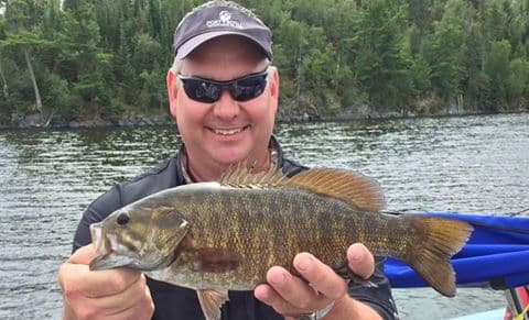 angler with smallmouth bass 