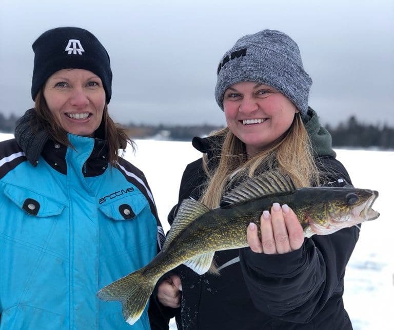 Two Female Angler Ice Fishing